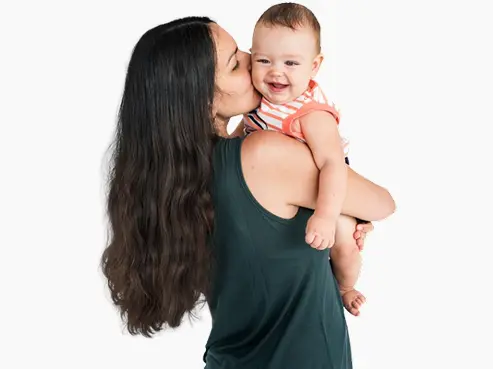 Mother kissing her baby
